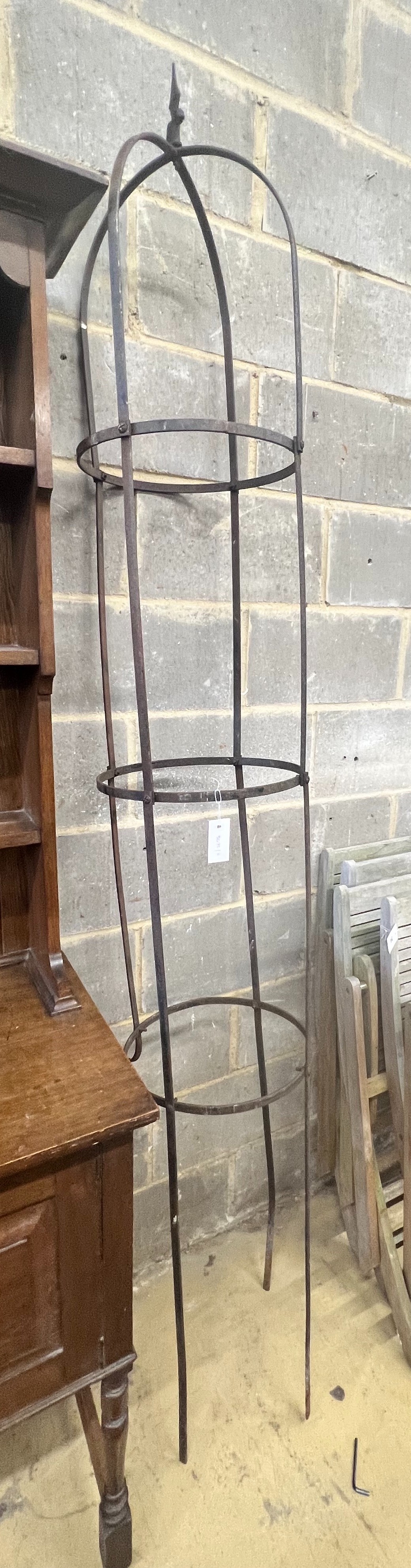 A circular wrought iron garden growing frame, height 246cm